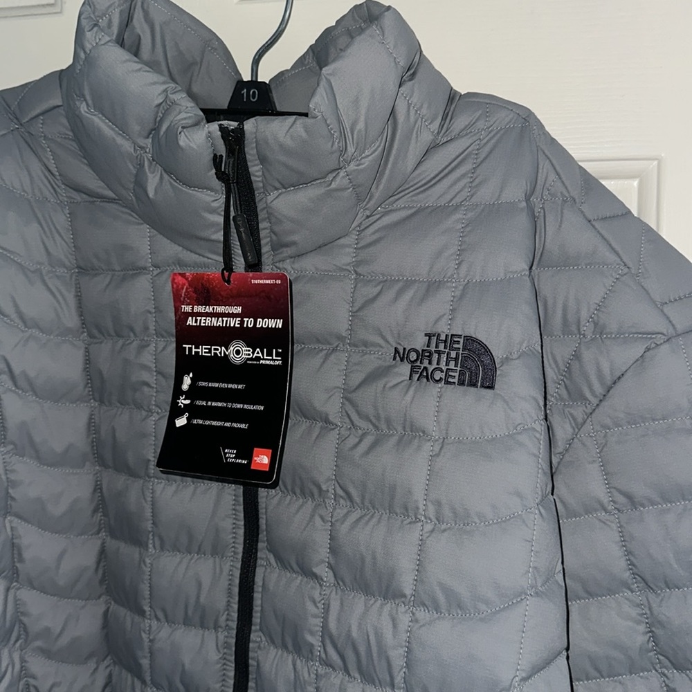gray north face jacket